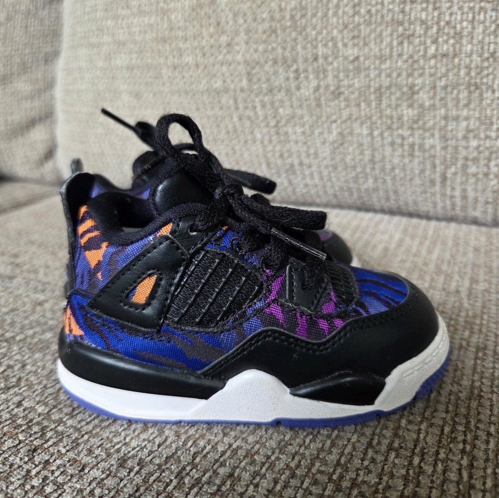 Jordan Black and Blue Air Jordan 4 Sneakers